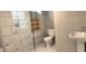 Basement bathroom with a walk-in shower and pedestal sink at 1902 Canterbury St, Decatur, GA 30032