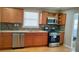 Updated kitchen with stainless steel appliances and granite countertops at 1902 Canterbury St, Decatur, GA 30032