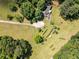Drone image of cozy home on expansive property featuring a circular inground pool at 500 Cochran Rd, Covington, GA 30014