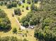 Expansive property featuring a charming home, a picturesque pond, and lush greenery from an aerial perspective at 500 Cochran Rd, Covington, GA 30014