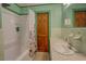 Bathroom featuring shower, tub, and marble countertop with updated fixtures at 500 Cochran Rd, Covington, GA 30014