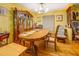 Bright dining room featuring hardwood floors, a chandelier, and a vintage china cabinet at 500 Cochran Rd, Covington, GA 30014