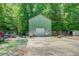 Garage and workshop area with plenty of room for vehicles, storage, and other equipment at 500 Cochran Rd, Covington, GA 30014