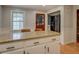 Kitchen with a granite topped breakfast bar and entry to another room at 500 Cochran Rd, Covington, GA 30014
