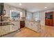 Well-lit kitchen with white cabinetry, granite countertops, and stainless steel appliances at 500 Cochran Rd, Covington, GA 30014