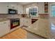 Charming kitchen features granite countertops, white cabinets, and modern appliances at 500 Cochran Rd, Covington, GA 30014