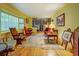 Living room featuring hardwood floors, classic furniture, and vintage decor at 500 Cochran Rd, Covington, GA 30014