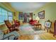 Spacious living room with hard wood flooring, fireplace and many windows at 500 Cochran Rd, Covington, GA 30014
