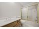 Updated bathroom showcasing a vanity sink, toilet, and shower with a gold-trimmed sliding door at 6 Dover Trl, Peachtree City, GA 30269