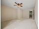 Spacious bedroom features a ceiling fan and neutral carpet at 6 Dover Trl, Peachtree City, GA 30269