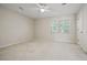 Bright bedroom offers a ceiling fan, carpet and natural light at 6 Dover Trl, Peachtree City, GA 30269