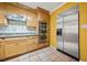 Updated kitchen boasts stainless steel appliances, tile backsplash, and wood cabinetry at 6 Dover Trl, Peachtree City, GA 30269