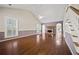 Spacious living room with high ceilings, fireplace, hardwood floors, and arched doorways at 6 Dover Trl, Peachtree City, GA 30269
