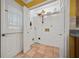 Open mud room includes a large window, exterior door, and a storage shelf at 6 Dover Trl, Peachtree City, GA 30269
