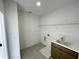 Functional laundry room with sink and shelving at 1960 Freestone Way, Marietta, GA 30064