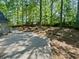 Expansive backyard with mature trees creating a private outdoor space for relaxation and recreation at 3213 Cedar Bluff Ne Dr, Marietta, GA 30062