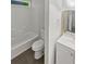 Clean, well-lit bathroom with a shower-tub combination, modern fixtures, and neutral decor at 3213 Cedar Bluff Ne Dr, Marietta, GA 30062