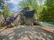 Unique two-story home with a pool and deck providing a private outdoor space for relaxation and recreation at 3213 Cedar Bluff Ne Dr, Marietta, GA 30062