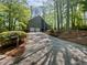 Charming two-story home with a two-car garage nestled among mature trees, offering a serene setting at 3213 Cedar Bluff Ne Dr, Marietta, GA 30062