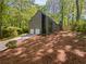 A-frame home with a two car garage and a wooded view at 3213 Cedar Bluff Ne Dr, Marietta, GA 30062