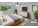 Cozy bedroom with a ceiling fan, ample natural light, and neutral decor, creating a relaxing retreat at 3213 Cedar Bluff Ne Dr, Marietta, GA 30062