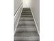 Carpeted staircase with neutral walls at 3213 Cedar Bluff Ne Dr, Marietta, GA 30062