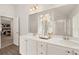 Double vanity bathroom with a large mirror and a walk-in shower at 565 Abbott Se Ct, Atlanta, GA 30354