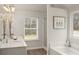 Bright bathroom boasts double vanity, soaking tub, and separate shower at 565 Abbott Se Ct, Atlanta, GA 30354