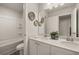 Bathroom featuring double vanity and tub at 565 Abbott Se Ct, Atlanta, GA 30354