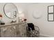 Stylish bedroom with sitting area and large mirror at 565 Abbott Se Ct, Atlanta, GA 30354