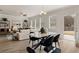 Open concept dining and living room with hardwood floors and access to backyard at 565 Abbott Se Ct, Atlanta, GA 30354