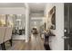 Elegant entryway with hardwood floors, a mirror, and a view into the living room at 565 Abbott Se Ct, Atlanta, GA 30354