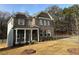 Brick two-story house with front yard and driveway at 565 Abbott Se Ct, Atlanta, GA 30354