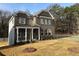 Beautiful brick home with inviting front porch and a meticulously landscaped front yard at 565 Abbott Se Ct, Atlanta, GA 30354