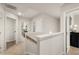 Bright and spacious upper hallway with neutral walls and carpet at 565 Abbott Se Ct, Atlanta, GA 30354