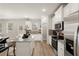 Spacious kitchen with island, stainless steel appliances, and hardwood floors at 565 Abbott Se Ct, Atlanta, GA 30354