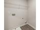 Convenient laundry room with shelving and hookups at 565 Abbott Se Ct, Atlanta, GA 30354