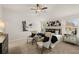 Main bedroom with king bed, two armchairs, and large windows at 565 Abbott Se Ct, Atlanta, GA 30354