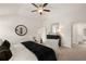 Main bedroom showcasing a king bed, armchairs, and an ensuite bathroom at 565 Abbott Se Ct, Atlanta, GA 30354