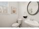 Powder room features a pedestal sink and a toilet at 565 Abbott Se Ct, Atlanta, GA 30354