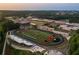 Aerial view of the Forsyth Central Bulldogs football stadium, track, and surrounding high school at 498 Pearl St, Cumming, GA 30040