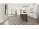 Open kitchen features a large island, modern appliances, and ample counter space at 5235 Maggie Mae Ln, Cumming, GA 30028