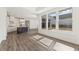Modern kitchen boasts an island, stainless steel appliances, and plenty of natural light at 5235 Maggie Mae Ln, Cumming, GA 30028