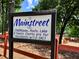Community sign for Mainstreet, which offers clubhouse, pools, lake, and tennis courts at 5432 Post Road Pass, Stone Mountain, GA 30088