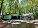 Well-maintained home with lush landscaping and private driveway at 5432 Post Road Pass, Stone Mountain, GA 30088