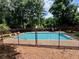 Relaxing community pool with plenty of space for residents to enjoy on a hot summer day at 5432 Post Road Pass, Stone Mountain, GA 30088