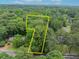 Aerial view of a tree-covered lot surrounded by lush greenery and other homes at 841 Hickory Dr, Marietta, GA 30064
