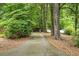 Long driveway leading to a wooded lot, providing privacy and a secluded atmosphere at 841 Hickory Dr, Marietta, GA 30064