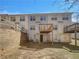 Backyard view of townhome with a wooden deck and fenced yard at 6941 Gallant Se Cir # 10, Mableton, GA 30126