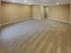 Large, carpeted basement space with neutral walls and recessed lighting at 6941 Gallant Se Cir # 10, Mableton, GA 30126